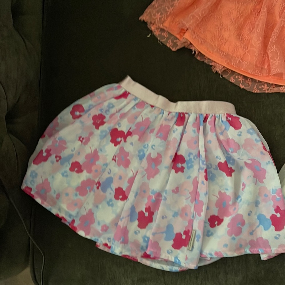 A lot of 4 Calvin Klein and popatu skirts sizes 5, 6x/7!